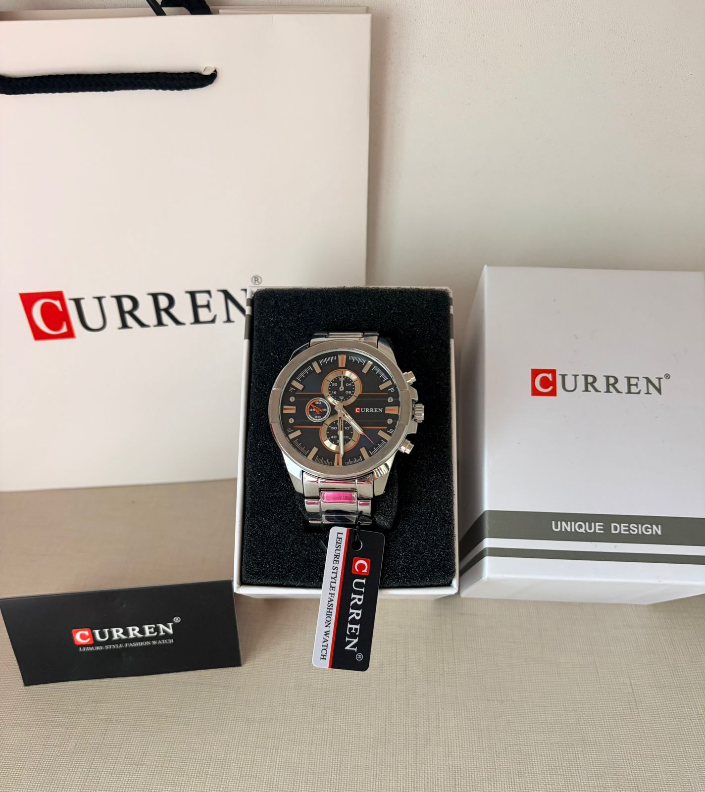 Curren Men's Chronograph Watch – Black Dial Silver Bracelet with Orange Accents - Timavie