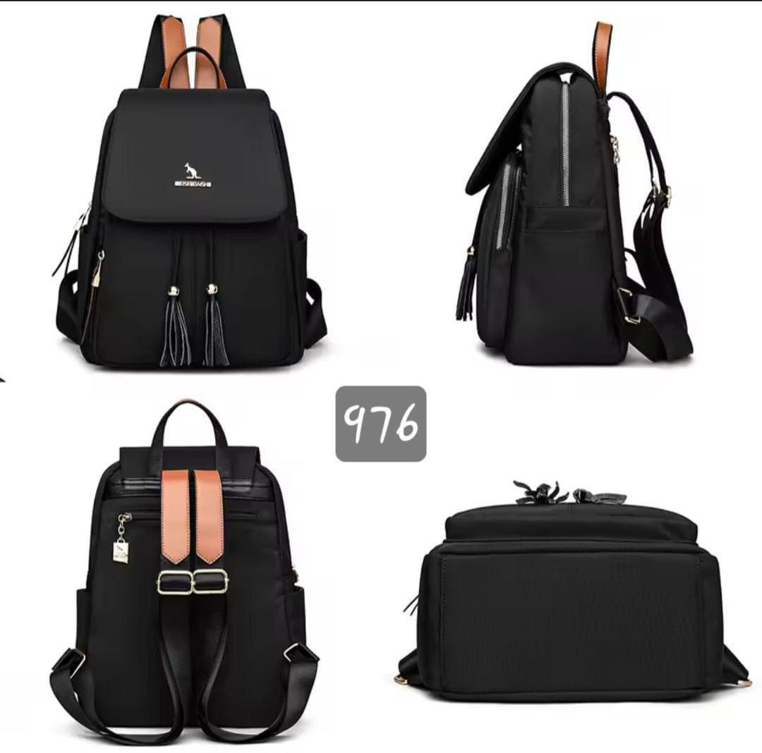 Women's black tassel backpack with tan leather accents, anti-theft zipper, and dual carry straps – 4 angles view